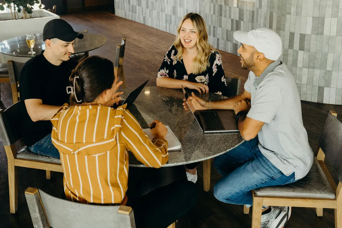 HR professionals reviewing total remuneration data in a casual modern office